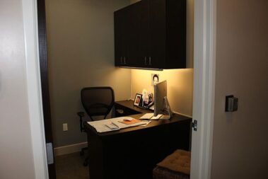 Office with lights dimmed.